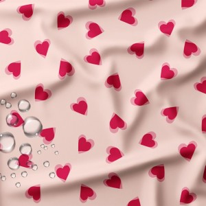TESSUTO IMPERMEABILE POPHEART CUORICINI FUCSIA SU BASE ROSA